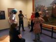 Stefan St-Laurent et des étudiant.es du cours de Jacques Arseneault dans l'exposition sur Évangéline du Musée Acadien
