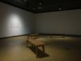 Roberto Santaguida, Signals, 2026. Bancs en bois, haut-parleurs vibrants, matériel audio, fresque murale peinte | Wooden benches, vibrating speakers, audio equipment, painted wall mural.